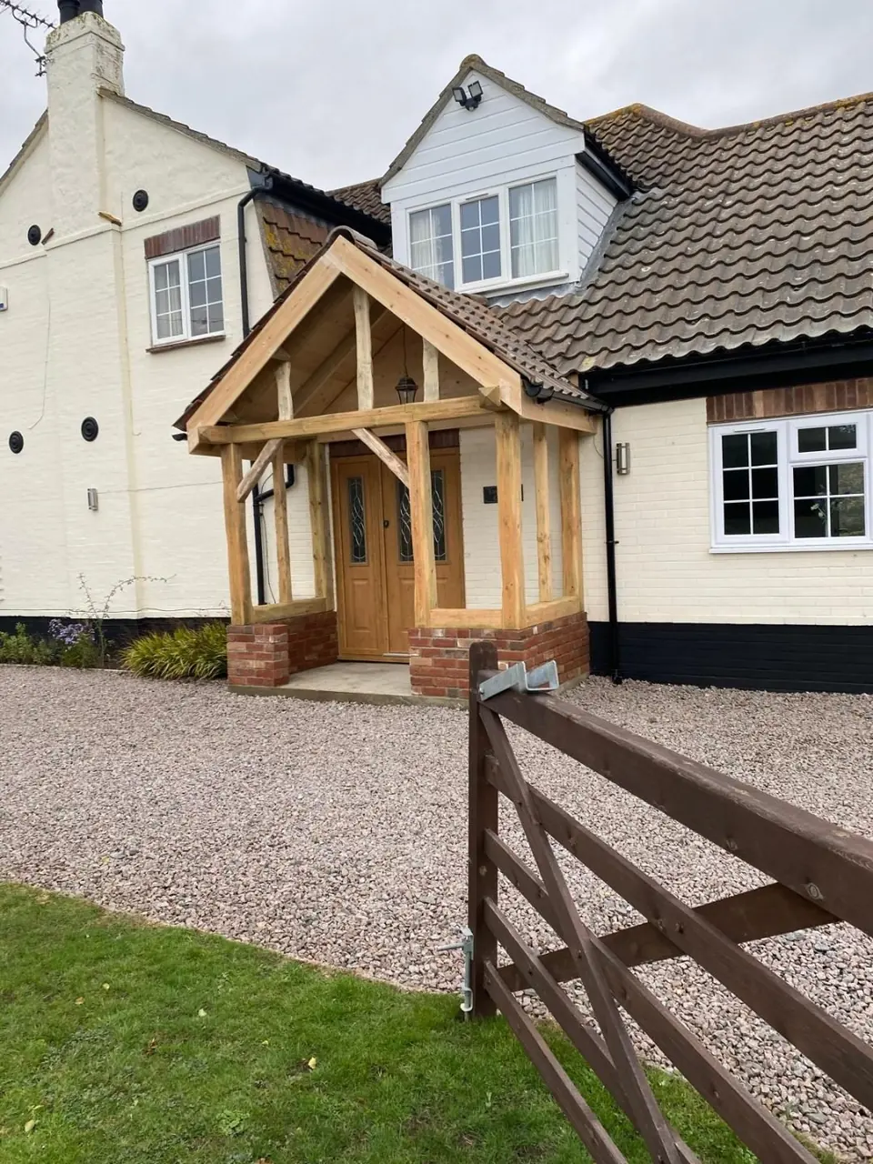 Completed oak porch seen from the front gate